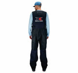 Person wearing a pair of black fishing bibs from the back, with an xpress boats logo on the back in red, black, and white.