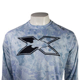 Close up of a light blue long-sleeve shirt with a camouflage pattern and a black xpress fish logo on the chest. 