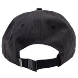 Rear view of a black baseball cap with an adjustable black strap and black plastic buckle, featuring a simms logo tag.