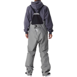 Back of gray bib overalls with suspender straps and a black xpress logo on the lower back.