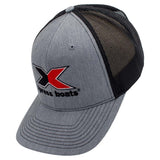 Side of a heather gray trucker-style baseball cap with black mesh back panels and a large embroidered 'Xpress boats' logo on the front.